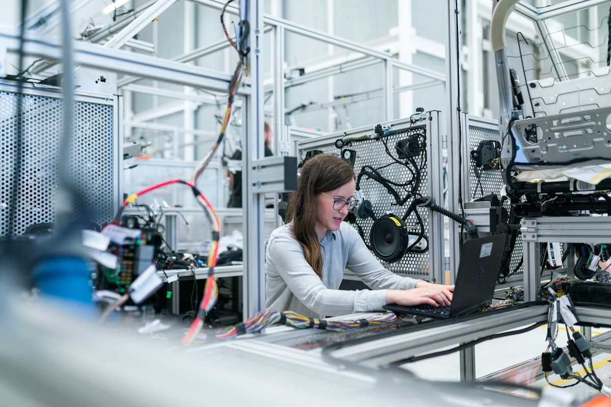 Engineer analysing machine data on a manufacturing line